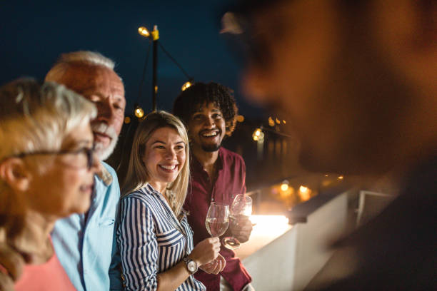 istock Lovely group of diverse age on a rooftop party 1078559998
