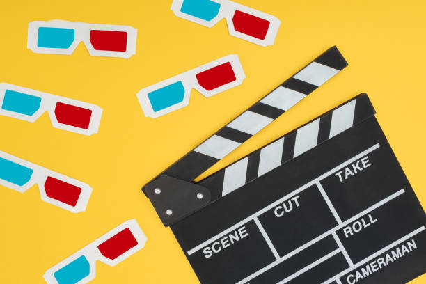 istock plastic 3d glasses and clapperboard isolated on yellow 1078566312