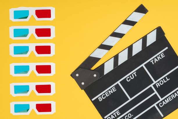 istock 3d glasses in vertical row and clapperboard isolated on yellow 1078566316