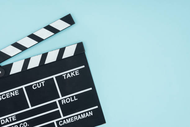 istock opened black movie clapperboard isolated on blue 1078566400