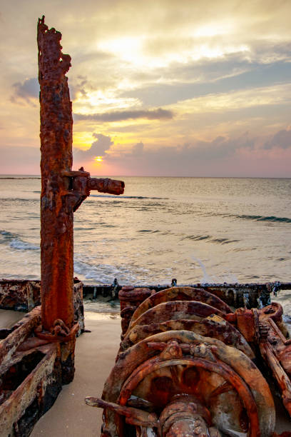 istock A ship sunk on the beach at sunset 1078569346