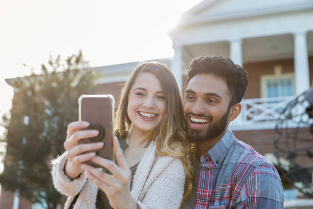 istock College couple take selfie together on campus 1078571646