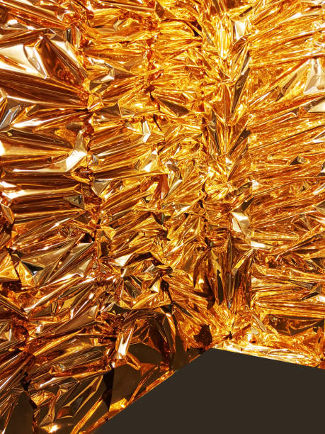 istock Vertical crumpled gold foil paper texture background. 1078578994