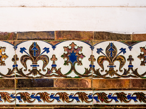 Santa Fe Style: Antique Mexican Talavera tiles; adobe wall, close-up.