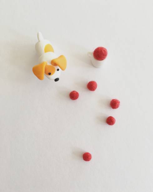Polymer clay dog and wool felt balls