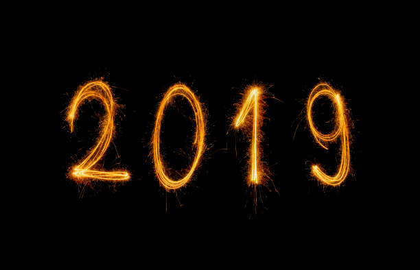 istock 2019 Happy new year text with sparkle fireworks isolated on black 1078583524