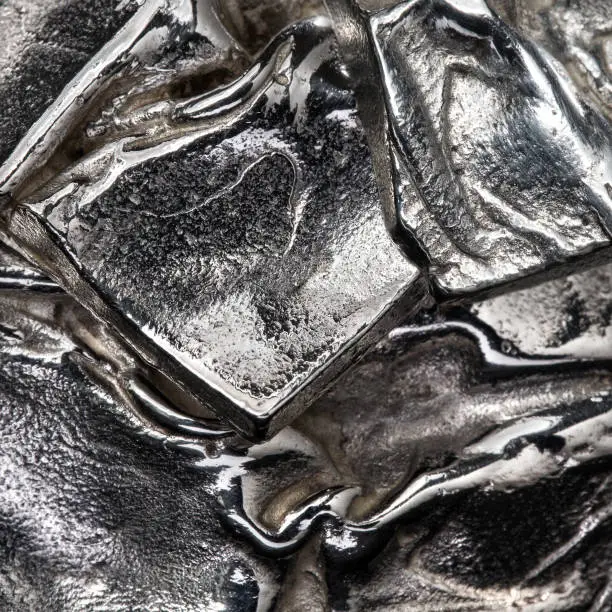 Silver metal background texture tile.