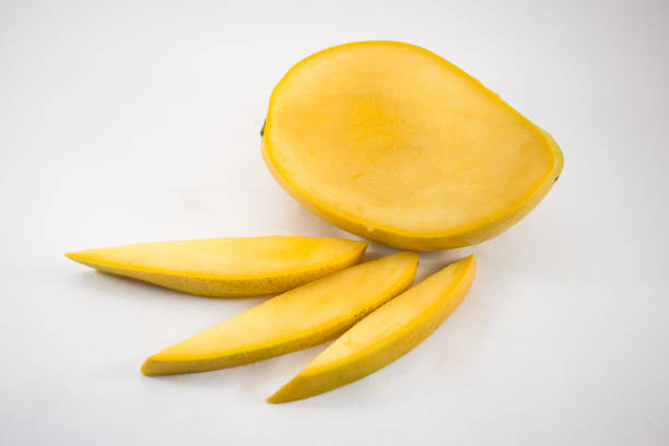 istock Yellow mango and mango slices isolated white background 1078584348