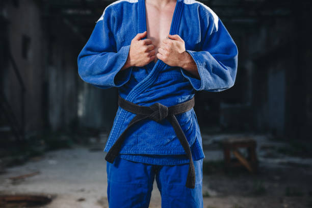 istock Determined judo athlete in a blue kimono 1078587004