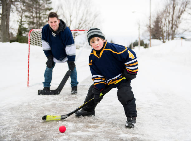 istock A nice Father and son playing hockey 1078587384