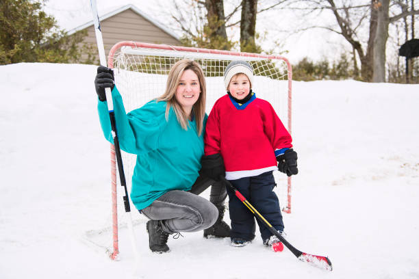 istock A Mother and son playing hockey having fun 1078587404