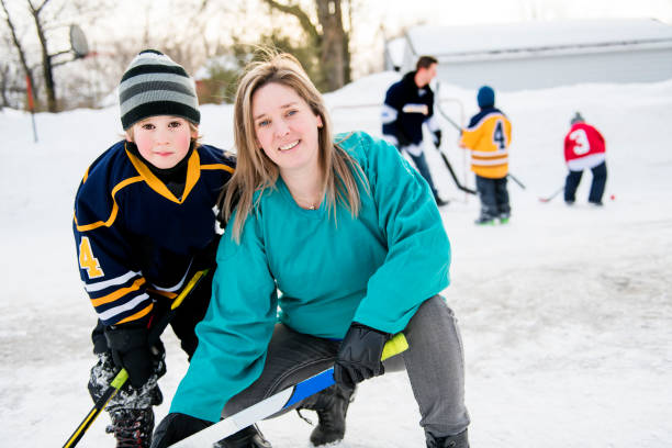 istock A Mother and son playing hockey having fun 1078587548