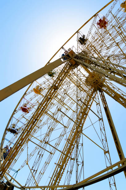 istock Ferris wheel on the background of a cloudless sky. Bottom view 1078589740