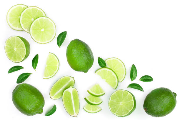 istock sliced lime vith leaves isolated on white background with copy space for your text. Top view. Flat lay pattern 1078591334