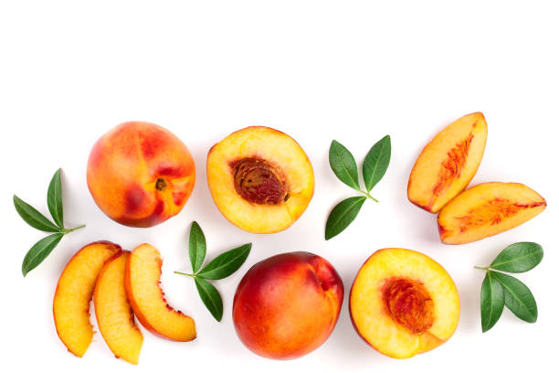 istock ripe nectarine with leaves isolated on white background with copy space for your text. Top view. Flat lay pattern 1078591528