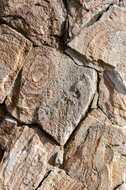 the brown texture of the masonry. background the brown texture of the masonry stone wall stone wall crag stock pictures, royalty-free photos & images