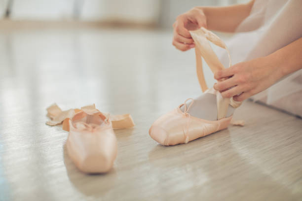 istock Ballerina tying her ballet pump 1078591822