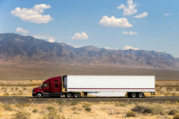 Fast and Powerful Heavy-Lift Modern Semi Truck Speeding on Highway, California, USA stock photo