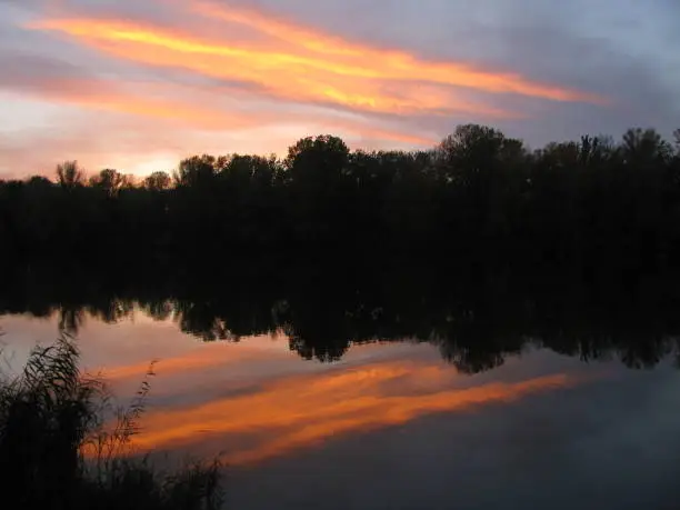 Beautiful autumn sunset on the river Dnieper