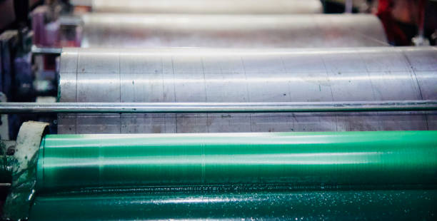 green metallic rolls of a printing machine - rolling up flash imagens e fotografias de stock