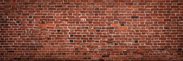 Panoramic brick wall with copy space Panoramic view of empty, old, red brick wall background with copy space old stone wall stock pictures, royalty-free photos & images