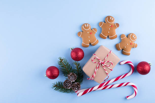 istock Simple festive design. Mockup for greeting, plans, wishes, goals. Christmas decorations on blue pastel  background. Flat lay. Merry Chraistmas and happy new year 2019 1078601270