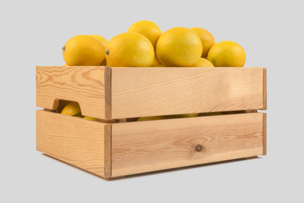 istock Fresh lemons in a wooden crate 1078609406