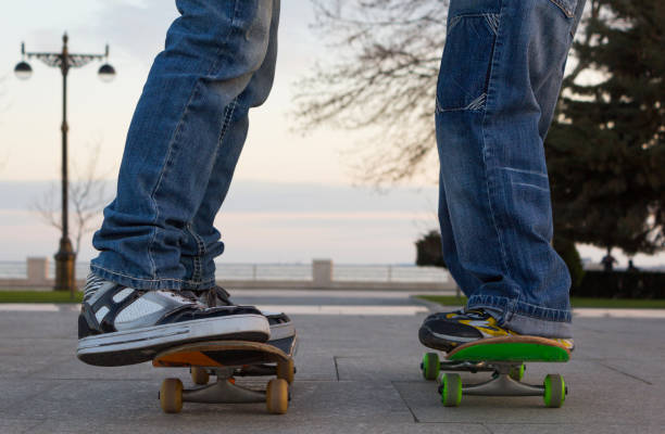istock Two young guys stand on skateboards 1078611762