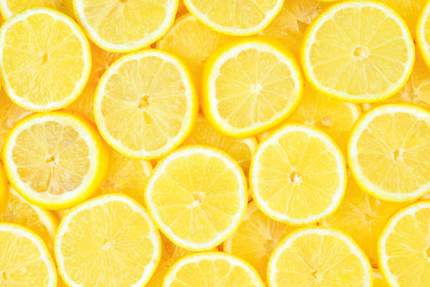istock A slices of fresh juicy yellow lemons.  Texture background, pattern. 1078623640