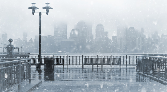 Black and white photo of New York City skyline on a rainy day