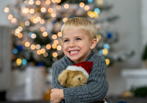 istock Cute little boy holding teddy bear 1078625020