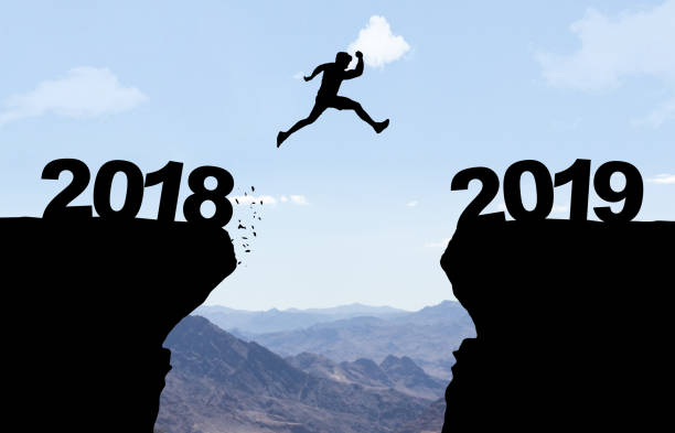 istock Man jumping over abyss with text 2018/2019 1078633644