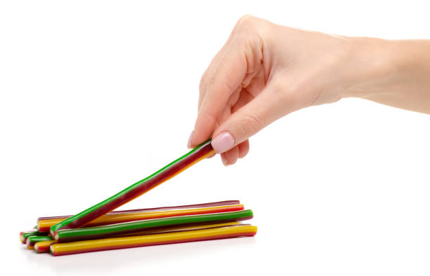istock Jelly candy sticks in hand 1078633680