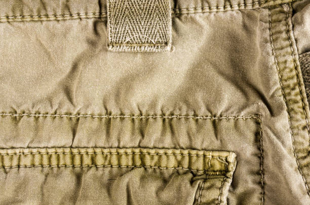 istock clothing items washed cotton fabric texture with seams 1078640490