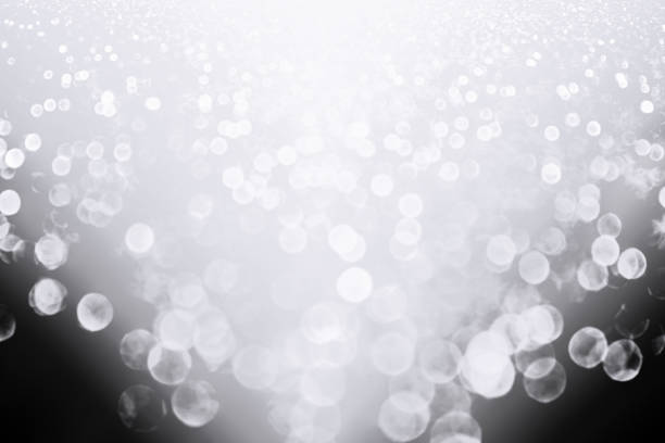 istock Silver White Glitter Snow on Dark Black Night Background 1078652110