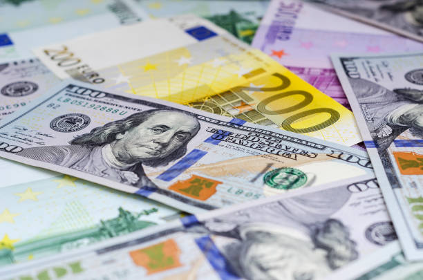 istock euro banknotes and dollars randomly laid out 1078687812