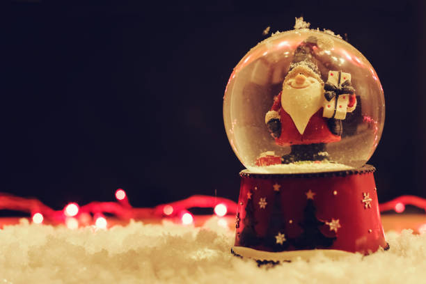 istock Santa In a Snow Globe Decoration Background 1078689354