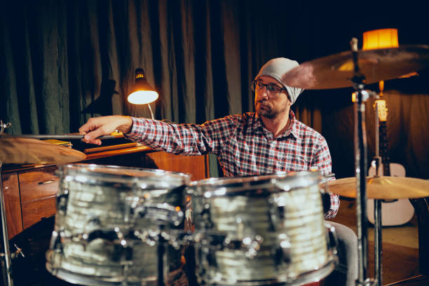 istock Caucasian drummer playing his instrument. 1078689412