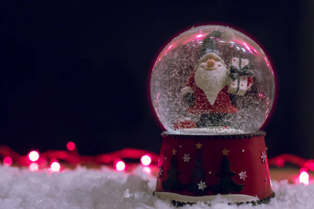 istock Decorative Christmas Snow Globe on a Black Background 1078691284