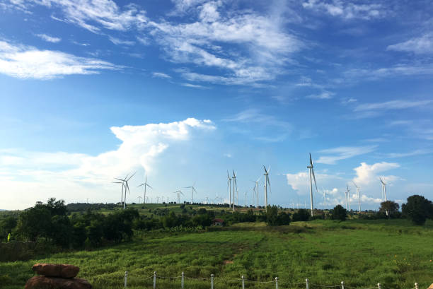 istock Windmills On Landscape Against Blue Sky 1078693166