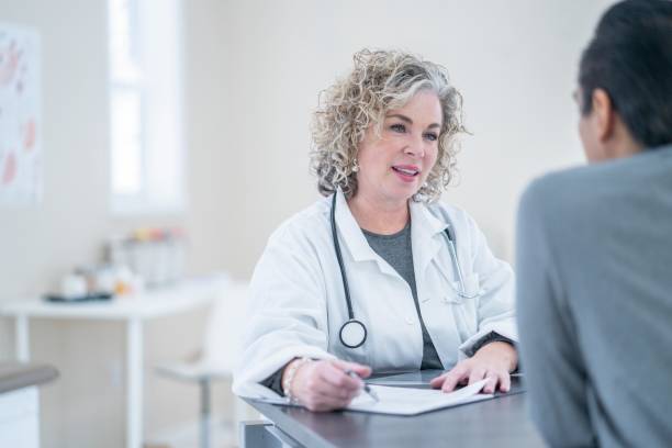 istock Doctor talking to man 1078702114