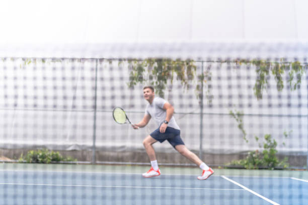 istock Male playing outdoor tennis 1078703690