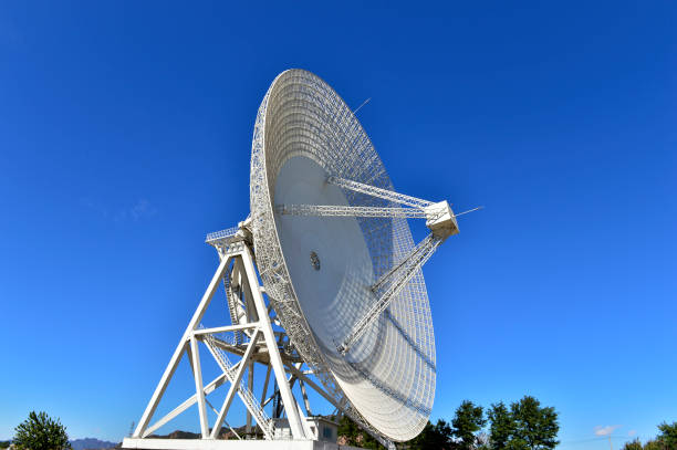 istock Array of satellite dishes or radio antennas against sky. Space o 1078710554