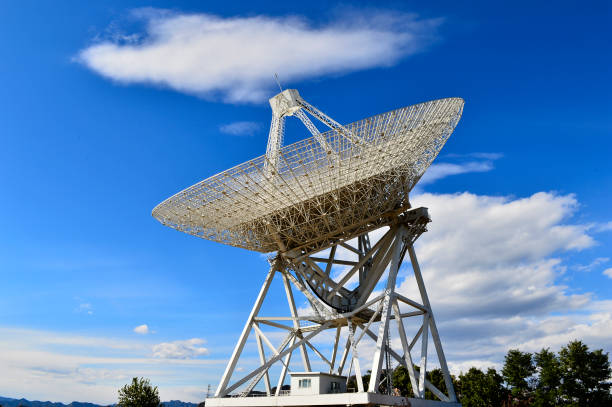 istock Array of satellite dishes or radio antennas against sky. Space o 1078711100