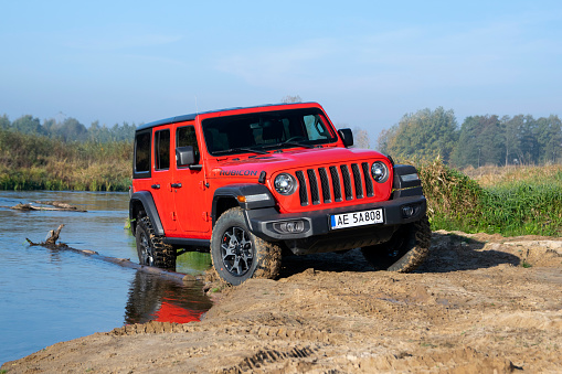 Seklak, Poland - 10 October, 2018: Jeep Wrangler Rubicon (JL) stopped on the riverside. This vehicle is used to get in extremely hard areas.