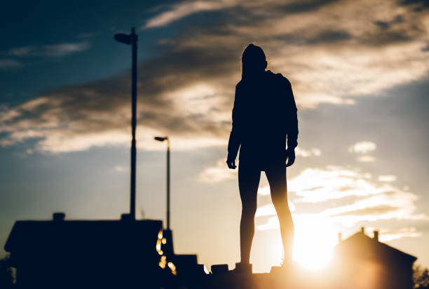 istock Female silhouette at urban district 1078739548