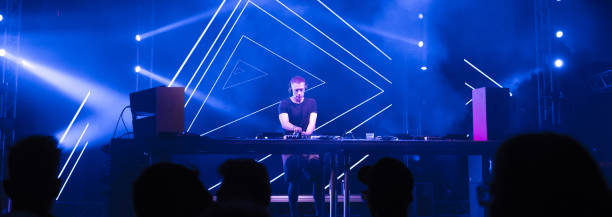 istock Dj playing techno music in the nightclub 1078746388