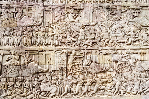 Bas relief depicting a battle Bas relief depicting a battle, Bayon Buddhist temple at Angkor Thom, Siem Reap, Cambodia angkor thom stock pictures, royalty-free photos & images