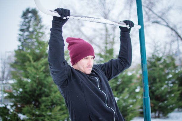 istock man working out in winter day. 1078748218