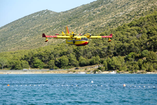 istock Firefighting plane takes on water 1078749528